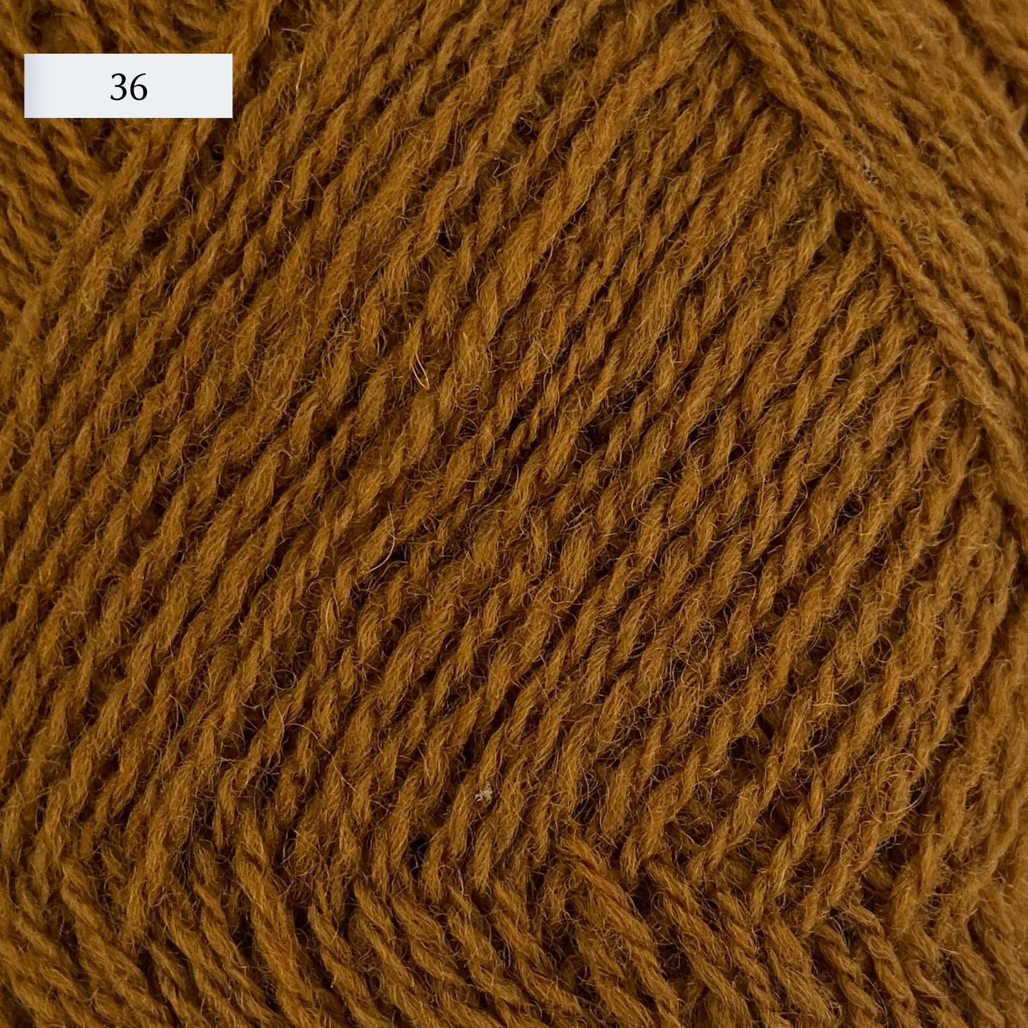 Rauma Lamullgarn, a fingering weight yarn, in color 36, a golden straw yellow-brown