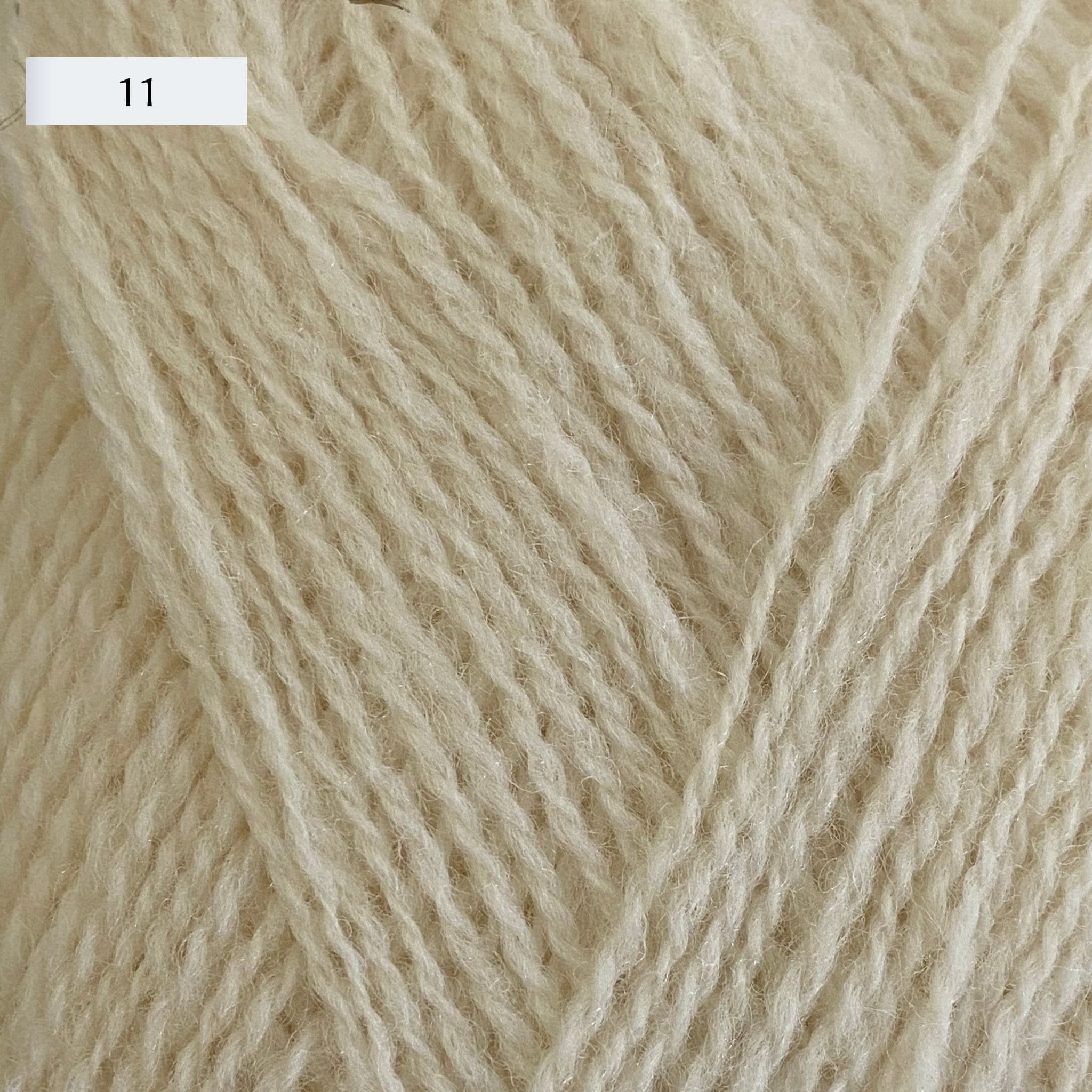 Rauma Lamullgarn, a fingering weight yarn, in color 11, a warm cream
