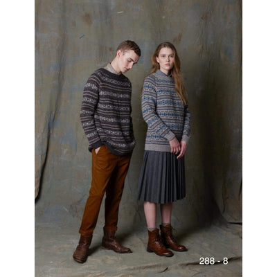 A man and woman in coordinating overall colorwork pullovers. Pattern is Rauma 288-8