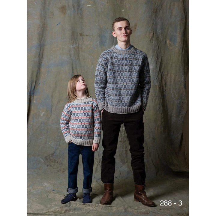 A man and a boy in coordinating colorwork pullovers knit in Strikkegarn using Rauma pattern 288-3