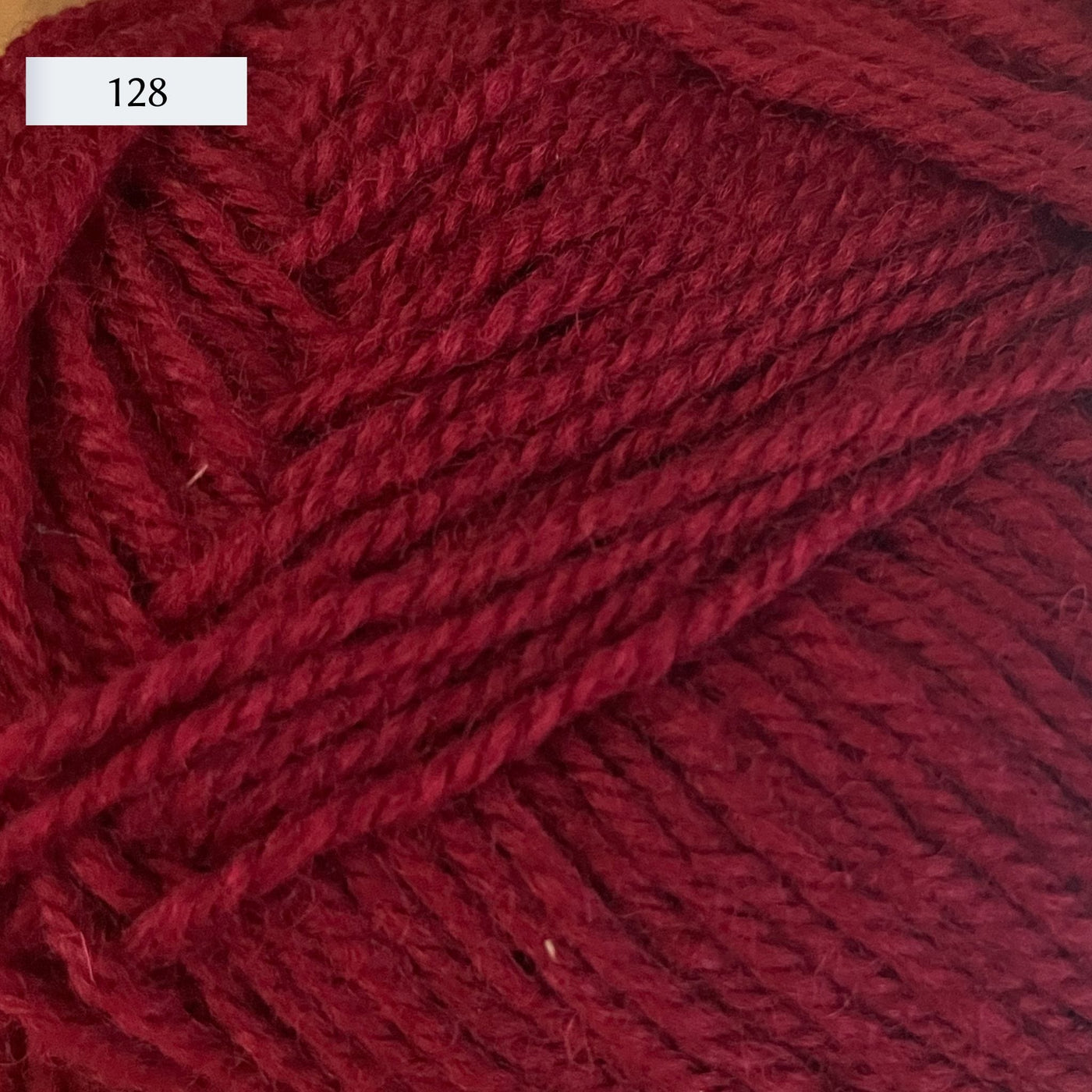 Rauma Strikkegarn, DK weight yarn, in color 128, deep raspberry red