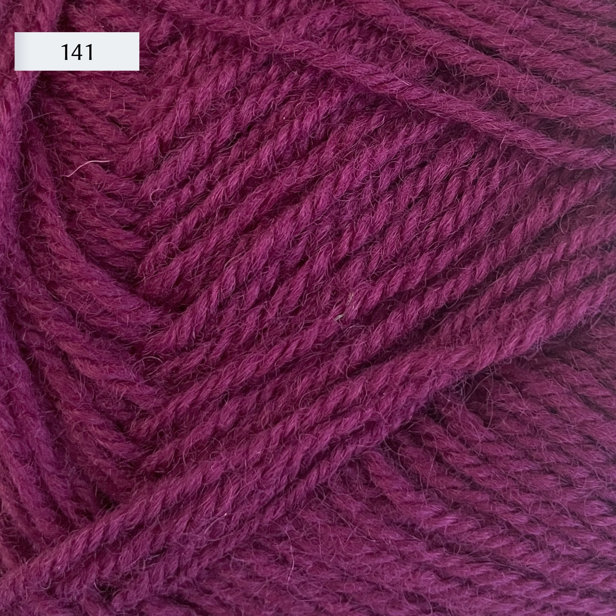 Rauma Strikkegarn, DK weight yarn, in color 141, mid-tone magenta