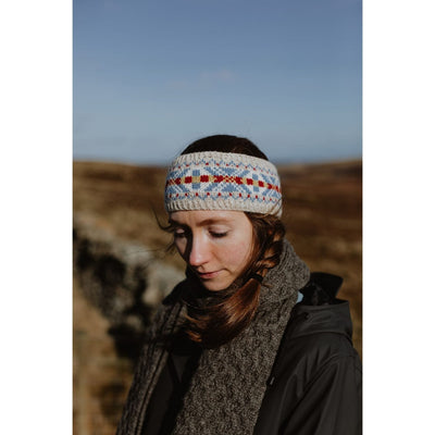 Page of Shetland Wool Adventure Journal 4, showing woman wearing colorwork headband which is a pattern in the book.