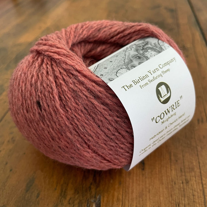 Birlinn Yarn Company Hebridean 4ply yarn shown in colorway: Cowrie (coral pink color)