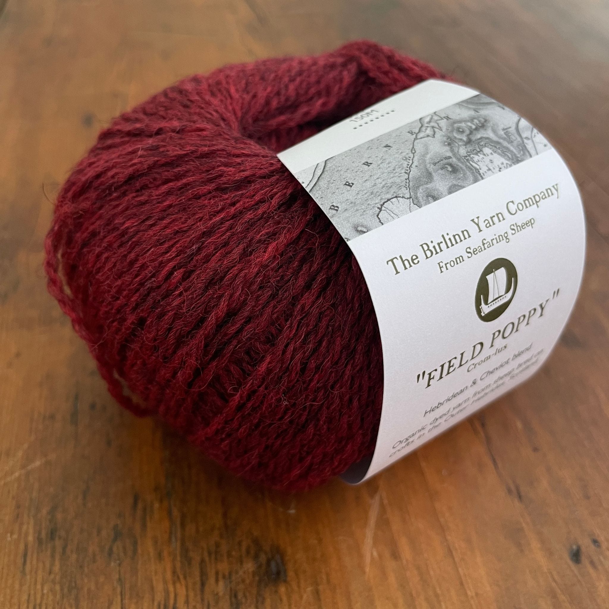 Birlinn Yarn Company Hebridean 4ply yarn shown in Field Poppy (heathered deep red)