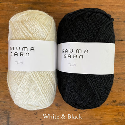 Rauma Tumi yarn; one cream ball and one black ball of yarn.