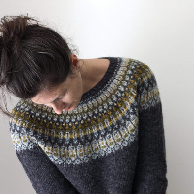 Top front view of female wearing Lunenburg Pullover by Amy Christoffers, knit in Lichen and Lace Rustic Sport weight yarn. 