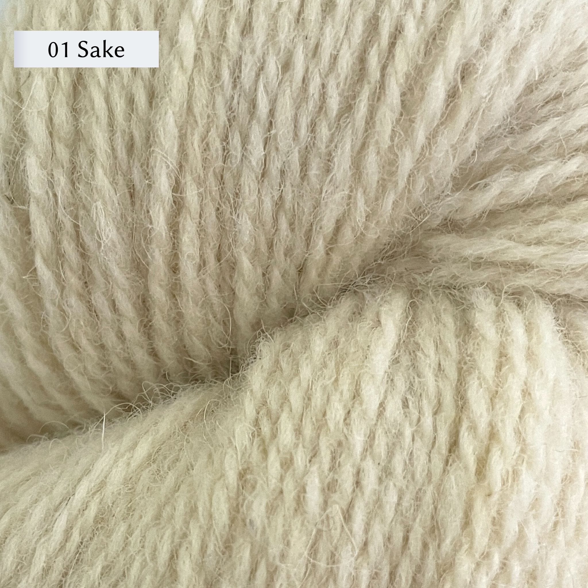 Tukuwool DK Yarn, 100% Finnish Wool shown in colorway 01 Sake which is a cream color. 