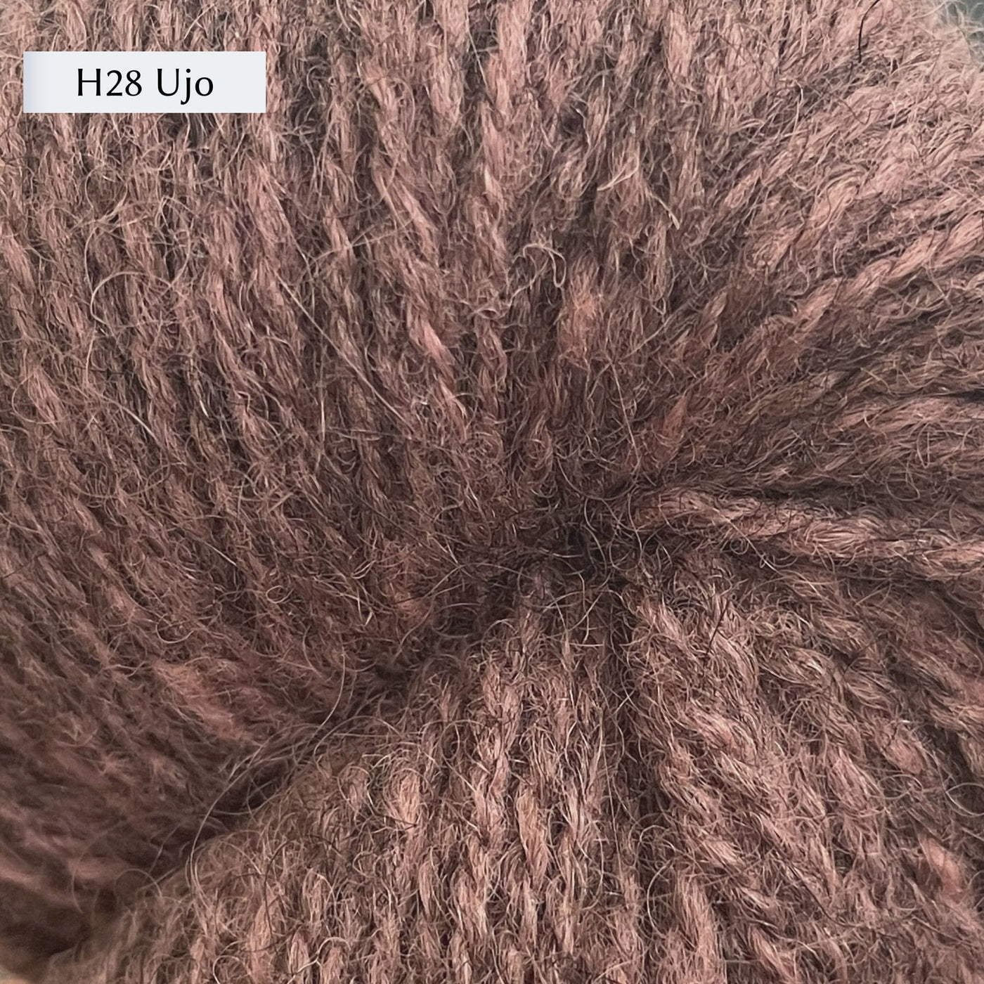 Tukuwool DK Yarn, 100% Finnish Wool shown in colorway H28 Ujo which is a heathered mauve color. 