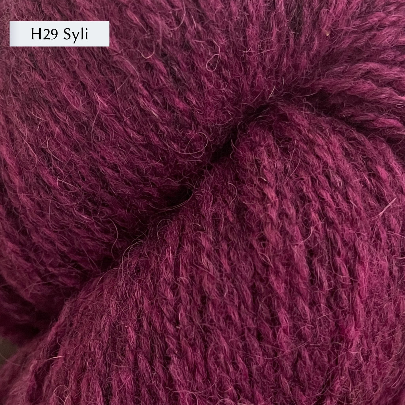Tukuwool DK Yarn, 100% Finnish Wool shown in colorway H29 Syli which is a bright heathered pink color. 