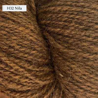 Tukuwool DK Yarn, 100% Finnish Wool shown in colorway H32 Nila which is a heathered brown gold color. 
