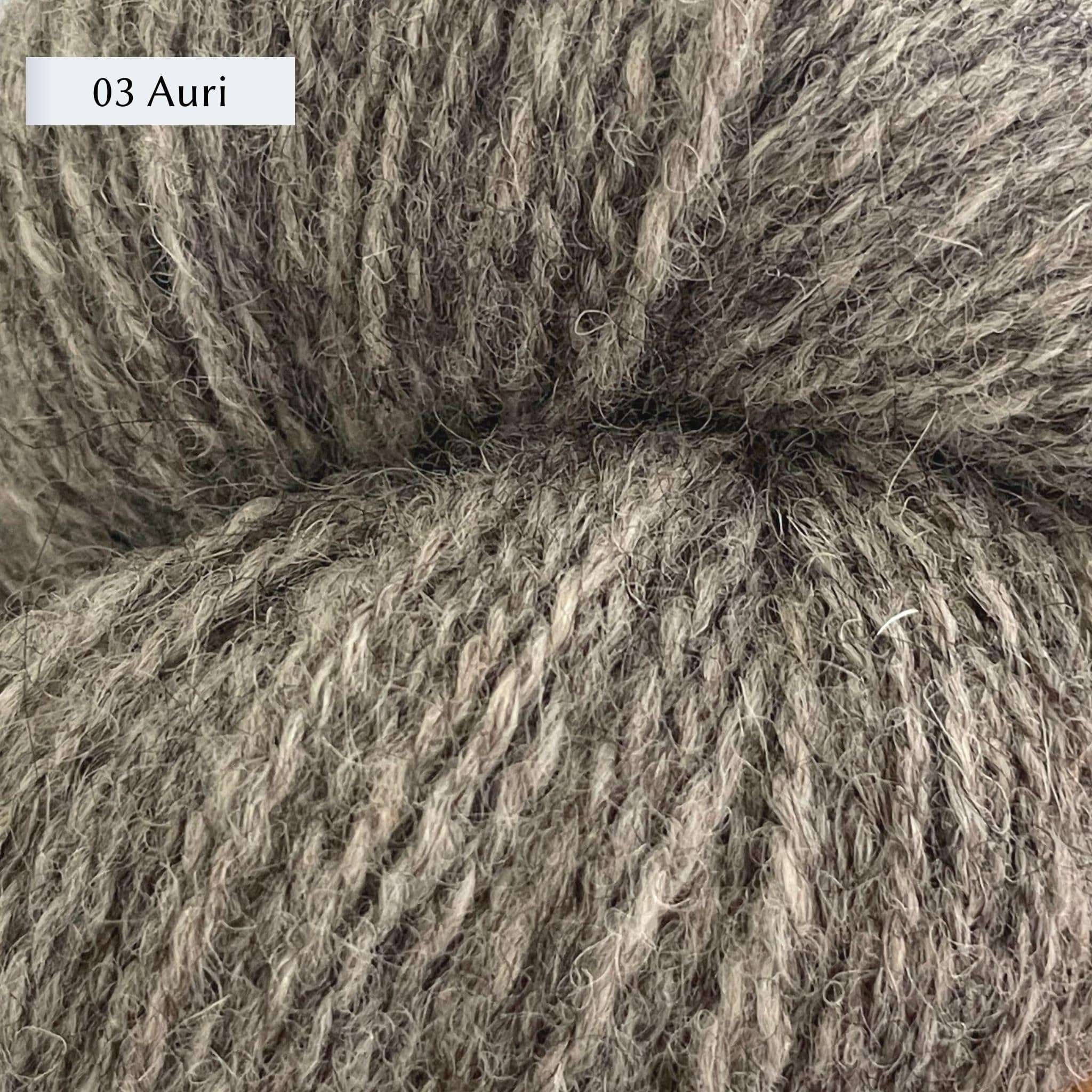 Tukuwool DK Yarn, 100% Finnish Wool shown in colorway 03 Auri which is a grey color. 