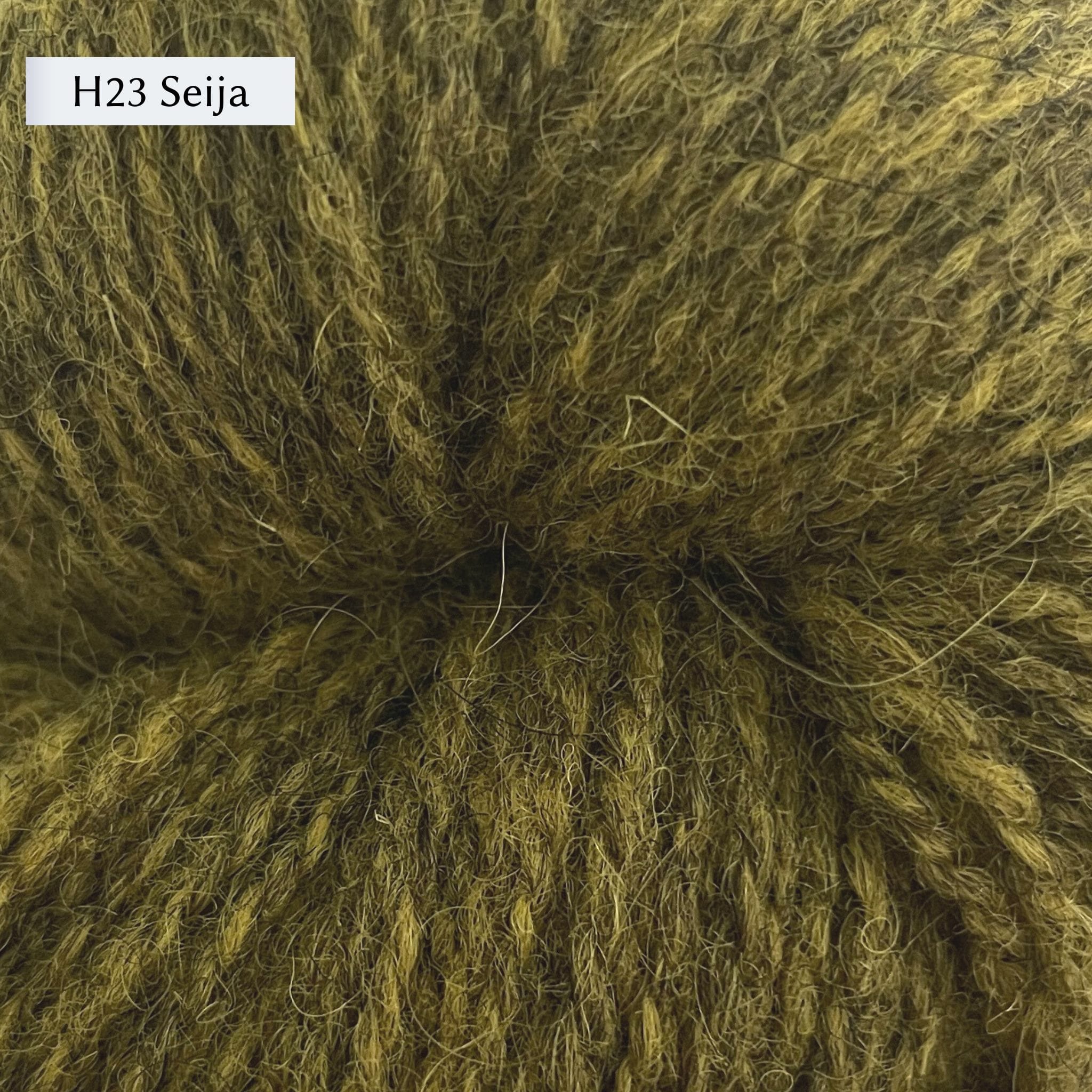 Tukuwool DK Yarn, 100% Finnish Wool shown in colorway H23 Seija which is a heathered green color.