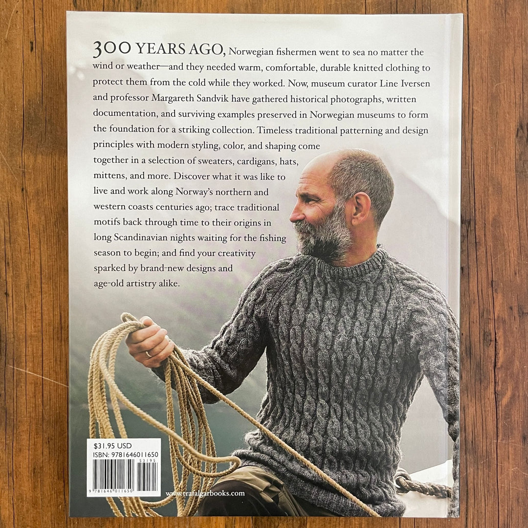 Back cover of Fishermen's Knits from the Coast of Norway book shows man in handknit sweater with fishing rope with article about history of clothing for Norwegian fishermen.