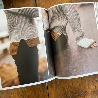 Inside pages of Fishermen's Knits from the Coast of Norway. Pages show knit sweater on model side, waist view and cuffs.