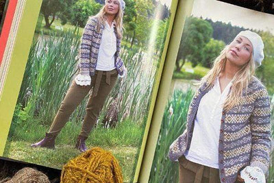 open book photos of woman posing in front of pond wearing color work cardigan 