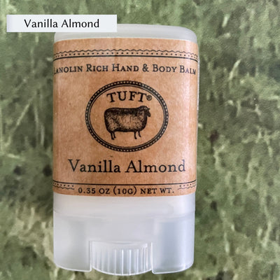 Container of Tufts Woolen Hand & Body Balm in scent called Vanilla Almond. 