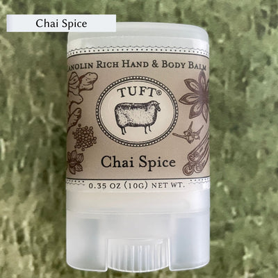 Container of Tufts Woolen Hand & Body Balm in scent called Chai Spice. 