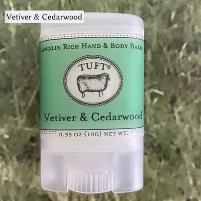 Container of Tufts Woolen Hand & Body Balm in scent called Vetiver & Cedarwood. 