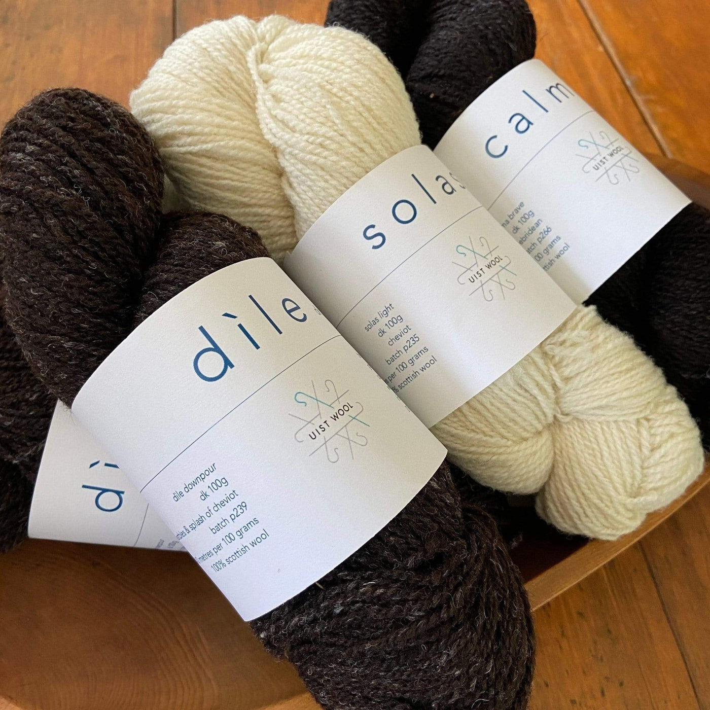 The Woolly Thistle Uist Wool DK yarn in black and cream colors