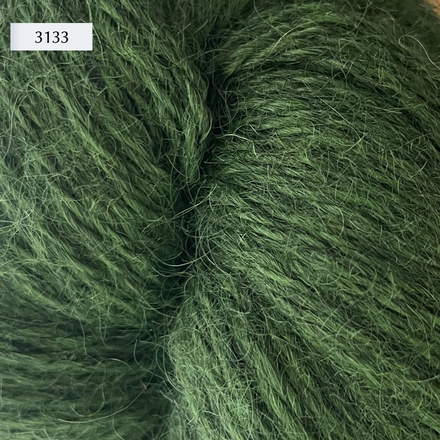 Ullcentrum 3ply, a worsted weight wool yarn, in color 3133, a mid-tone grass green