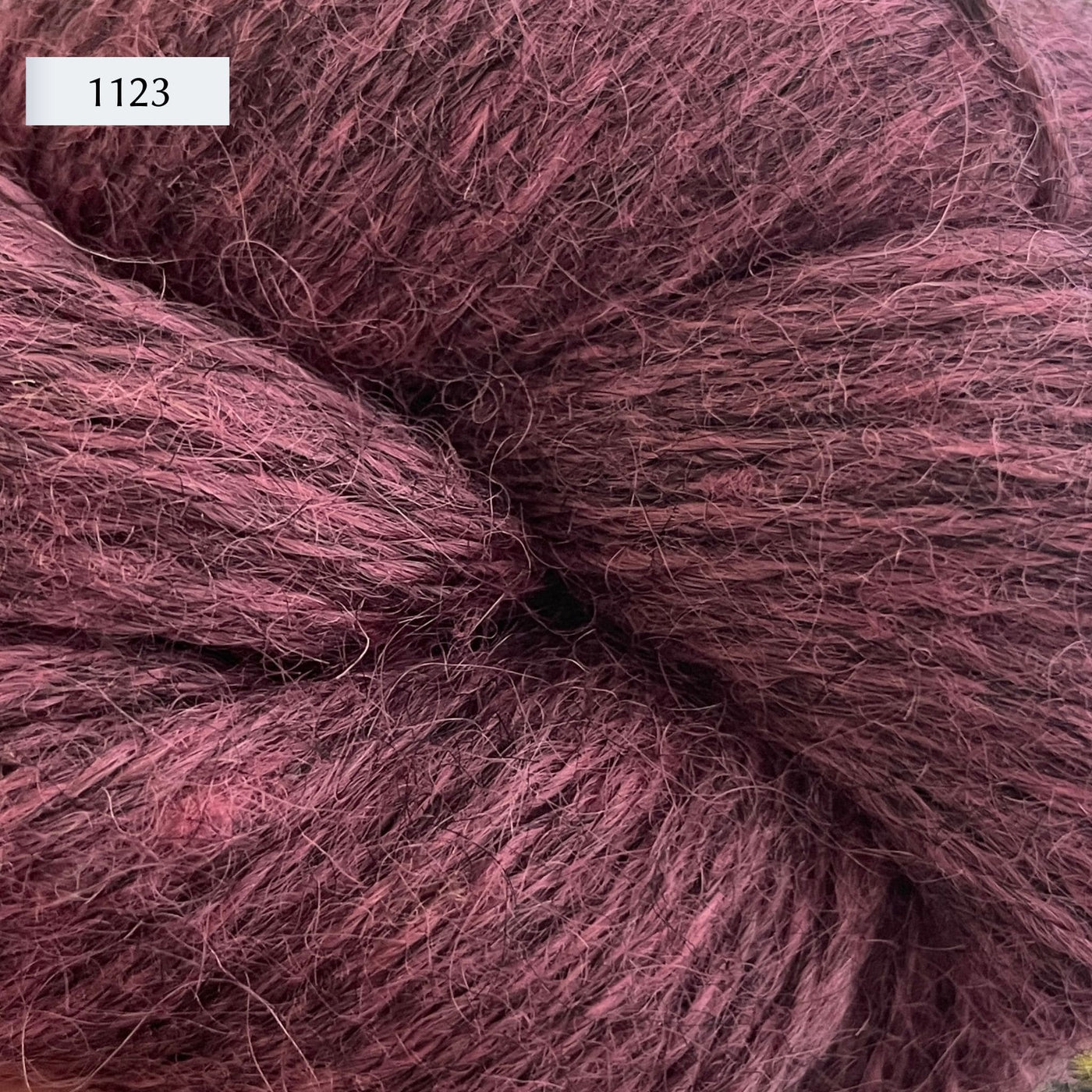 Ullcentrum 3ply, a worsted weight wool yarn, in color 1123, a light heathered plum pink