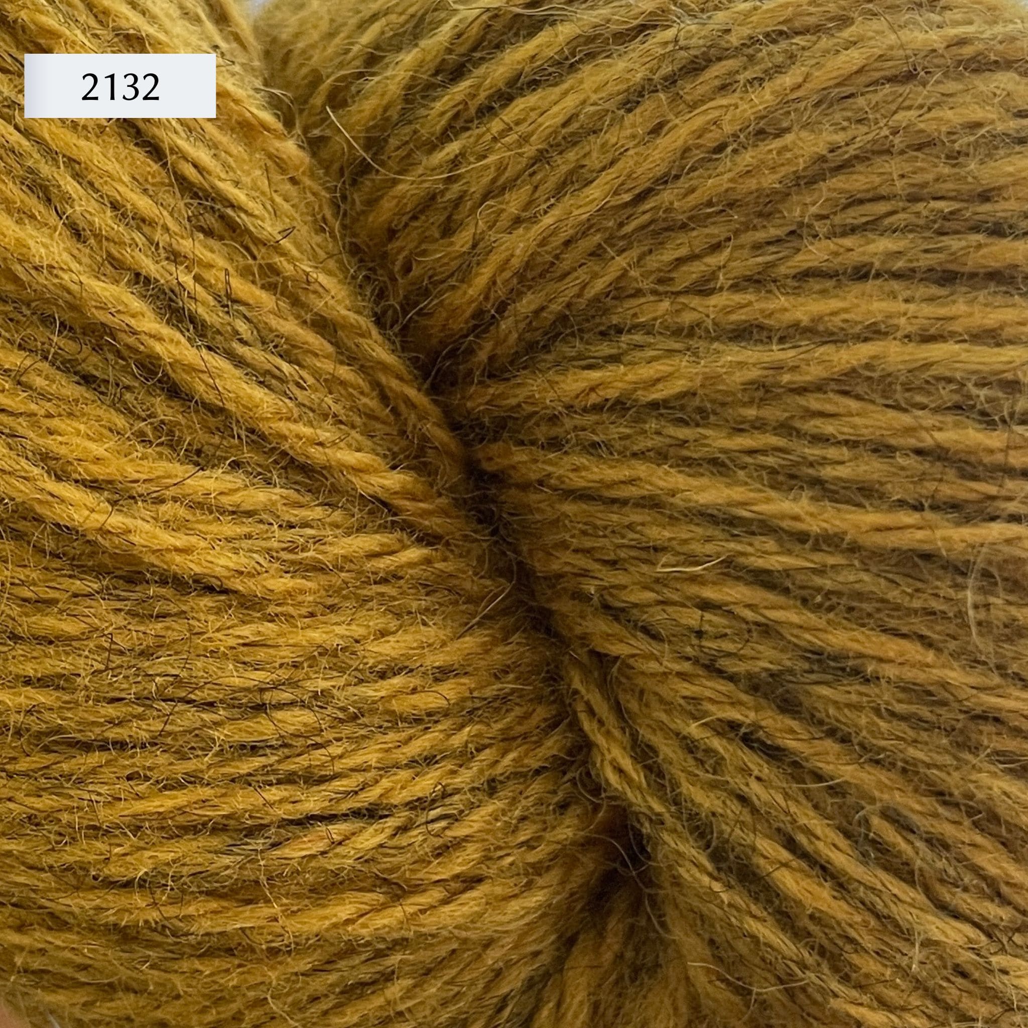 Ullcentrum 3ply, a worsted weight wool yarn, in color 2132, a heathered gold yellow