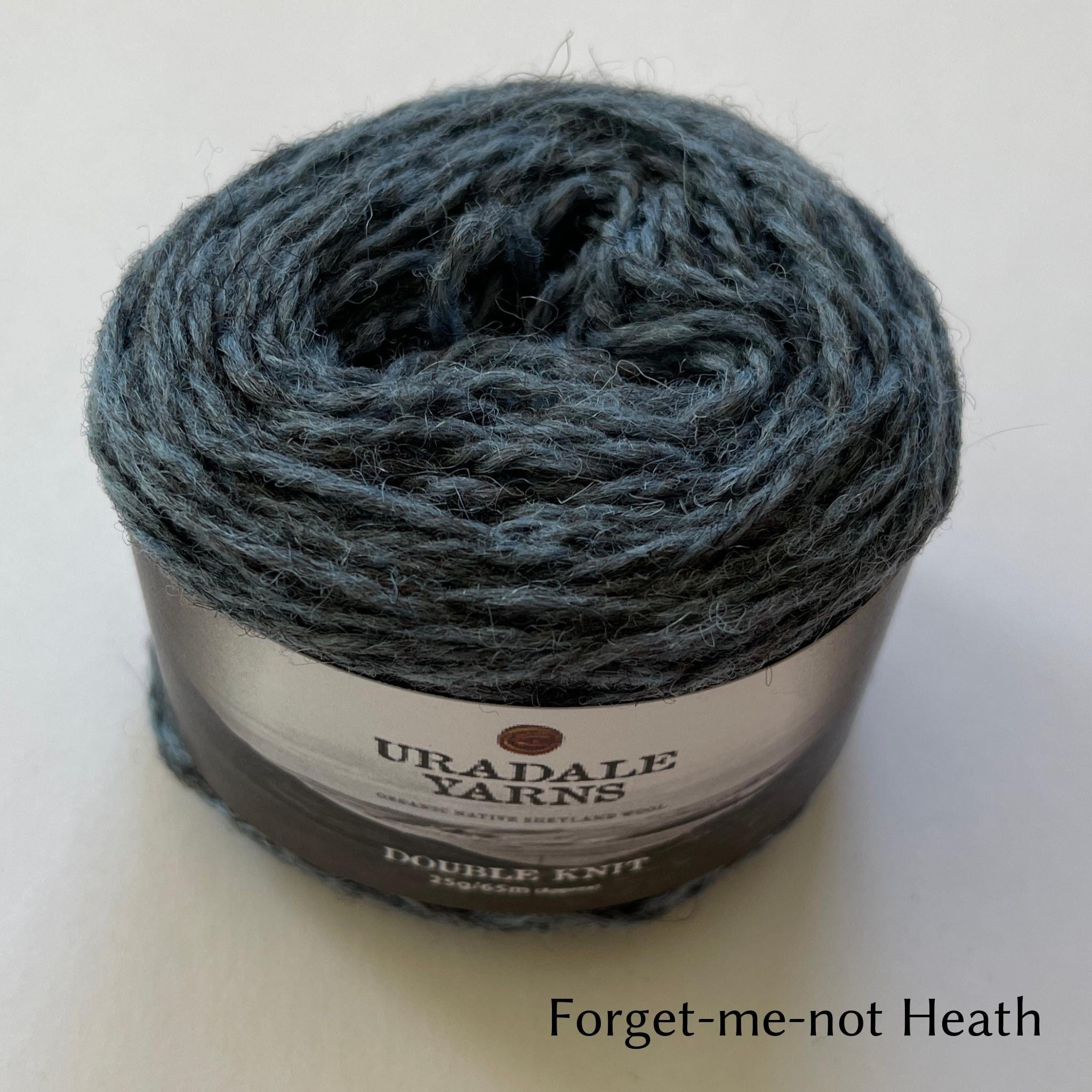 cake of Uradale yarn in color Forget-me-not Heath- heathered blue