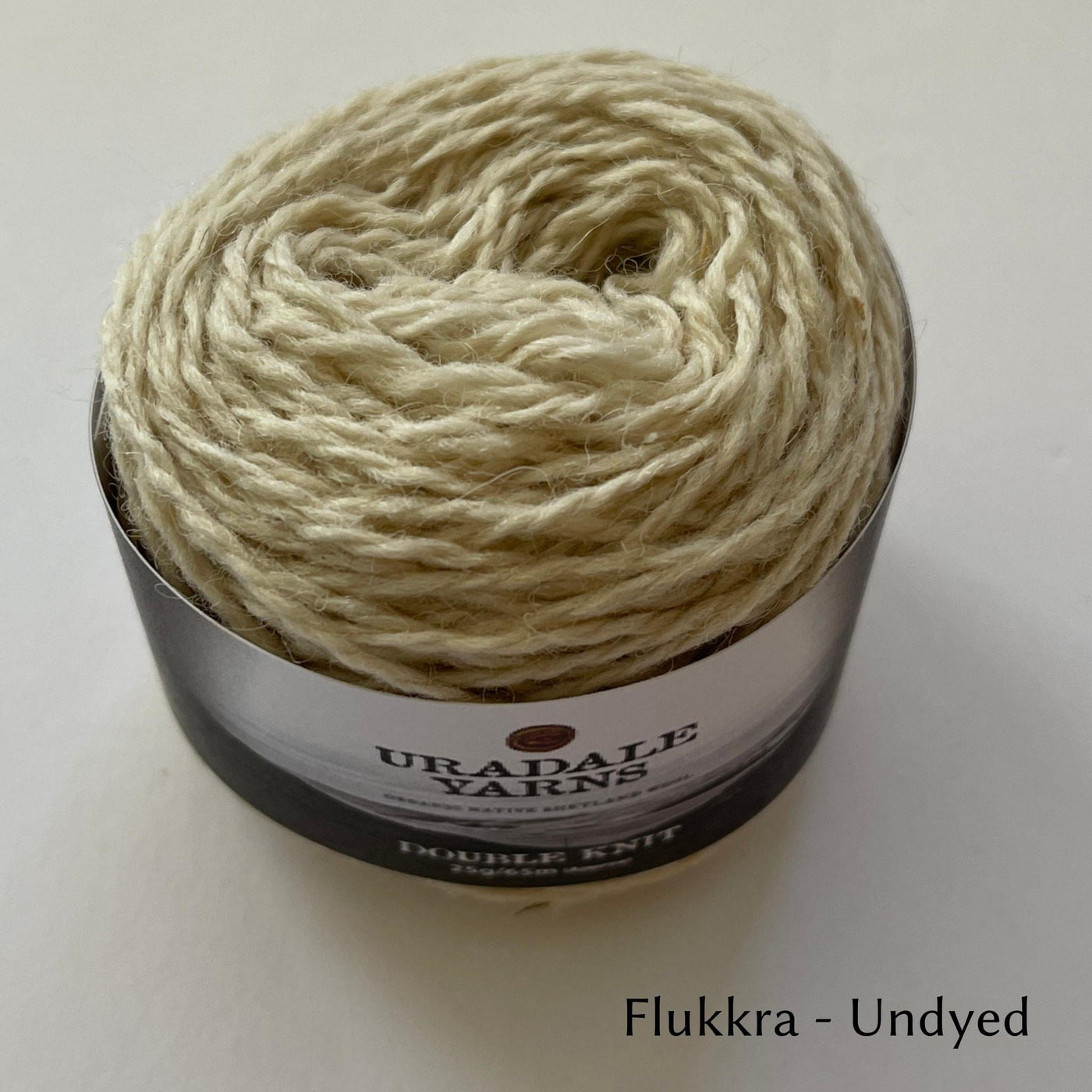 cake of Uradale DK yarn in color Flukkra - Undyed cream