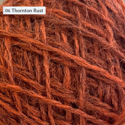Wensleydale Longwool Sheep Shop Tweed 4 ply, a fingering weight yarn, in color 06 Thornton Rust, a warm orange rust