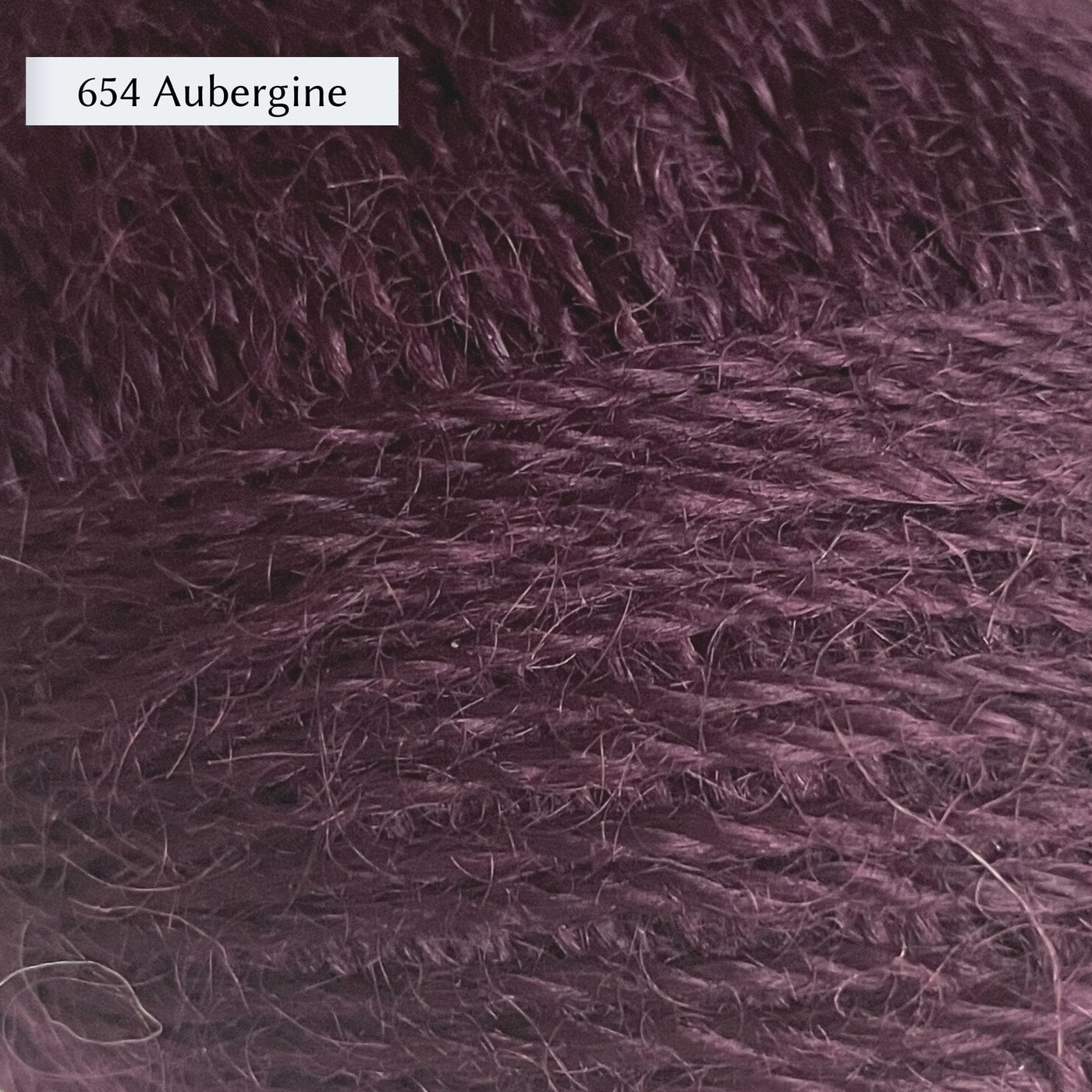 Wensleydale Longwool Sheep Shop 4ply yarn, a fingering weight yarn, in color 654 Aubergine, a mid-tone warm purple