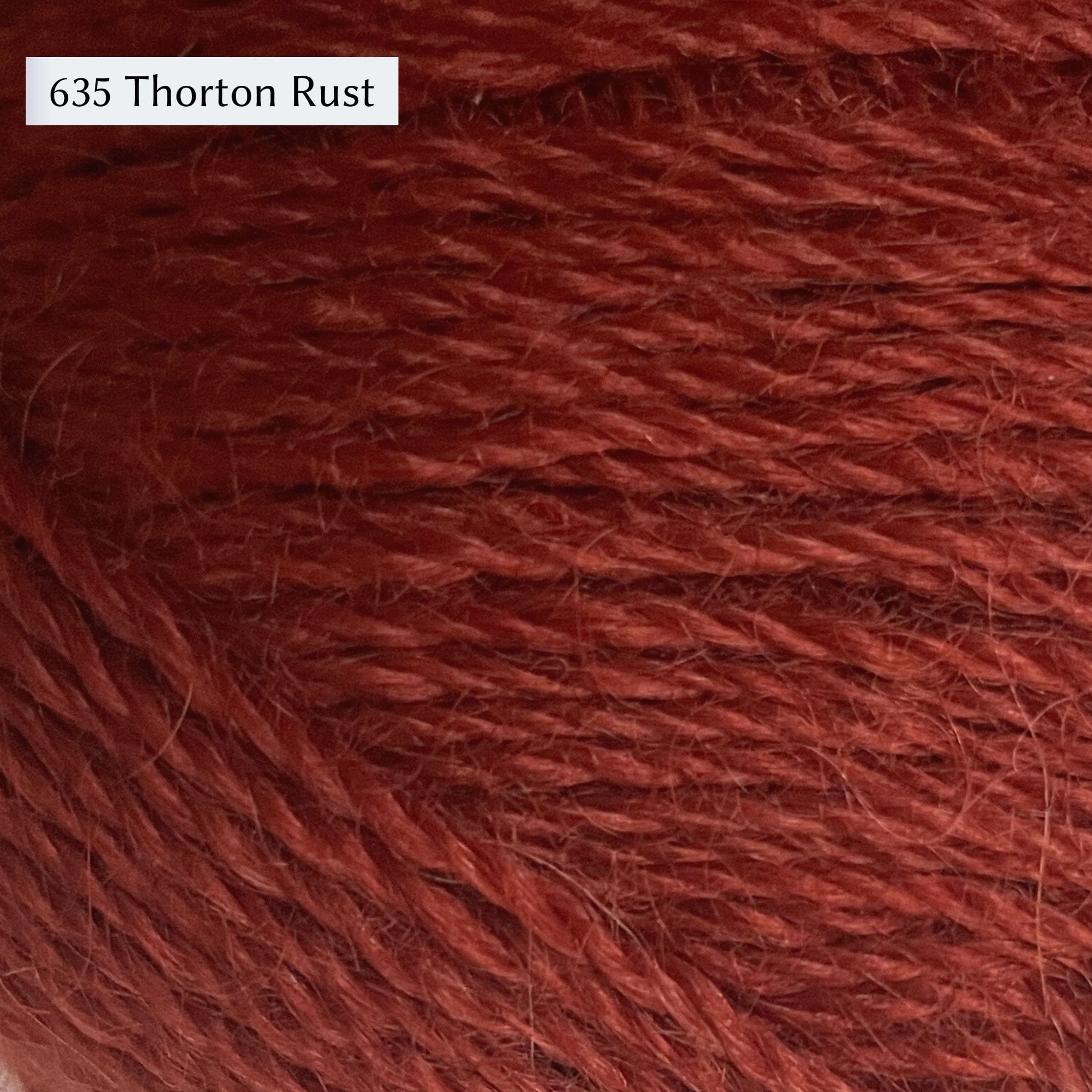 Wensleydale Longwool Sheep Shop 4ply yarn, a fingering weight yarn, in color 635 Thornton Rust, a rusty red-orange