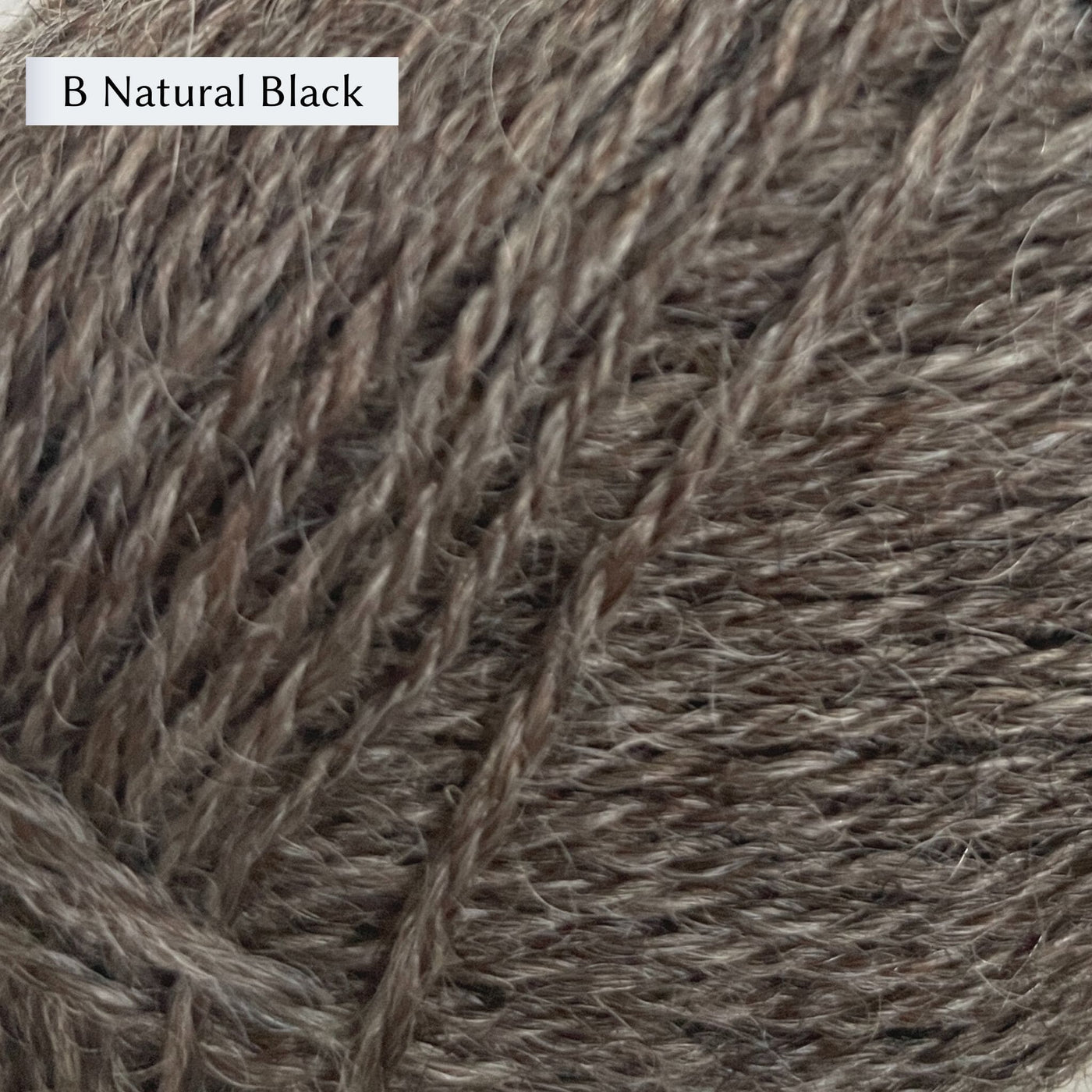 Wensleydale Longwool Sheep Shop 4ply yarn, a fingering weight yarn, in color B Natural Black, a dark warm brown