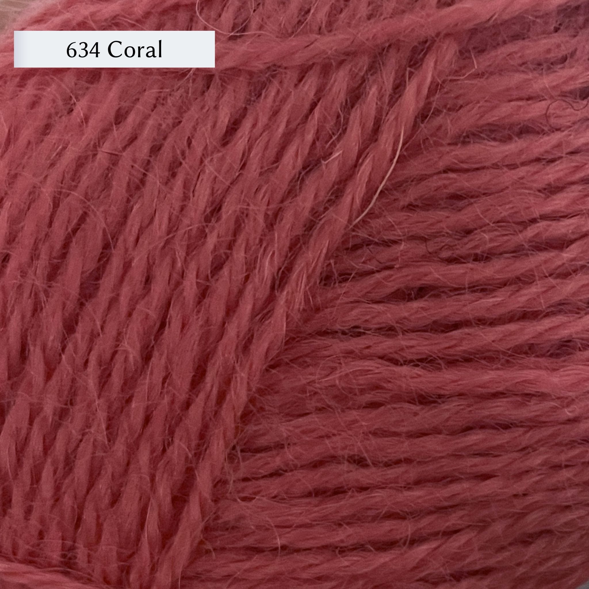 Wensleydale Longwool Sheep Shop 4ply yarn, a fingering weight yarn, in 634 Coral, a mid-tone pink-orange