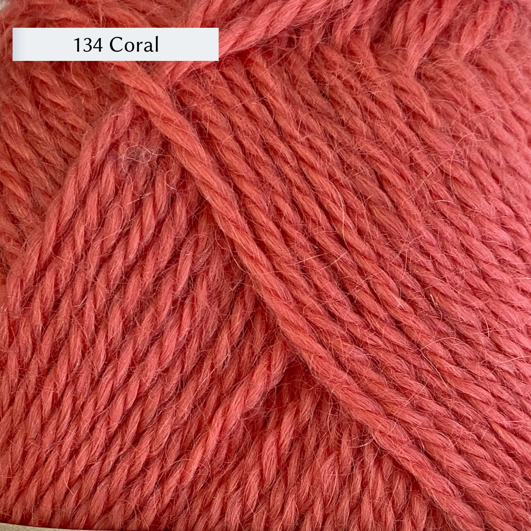 Wensleydale Longwool Aran, an aran weight yarn made from Wensleydale sheep, in color 134 Coral, a warm coral pink