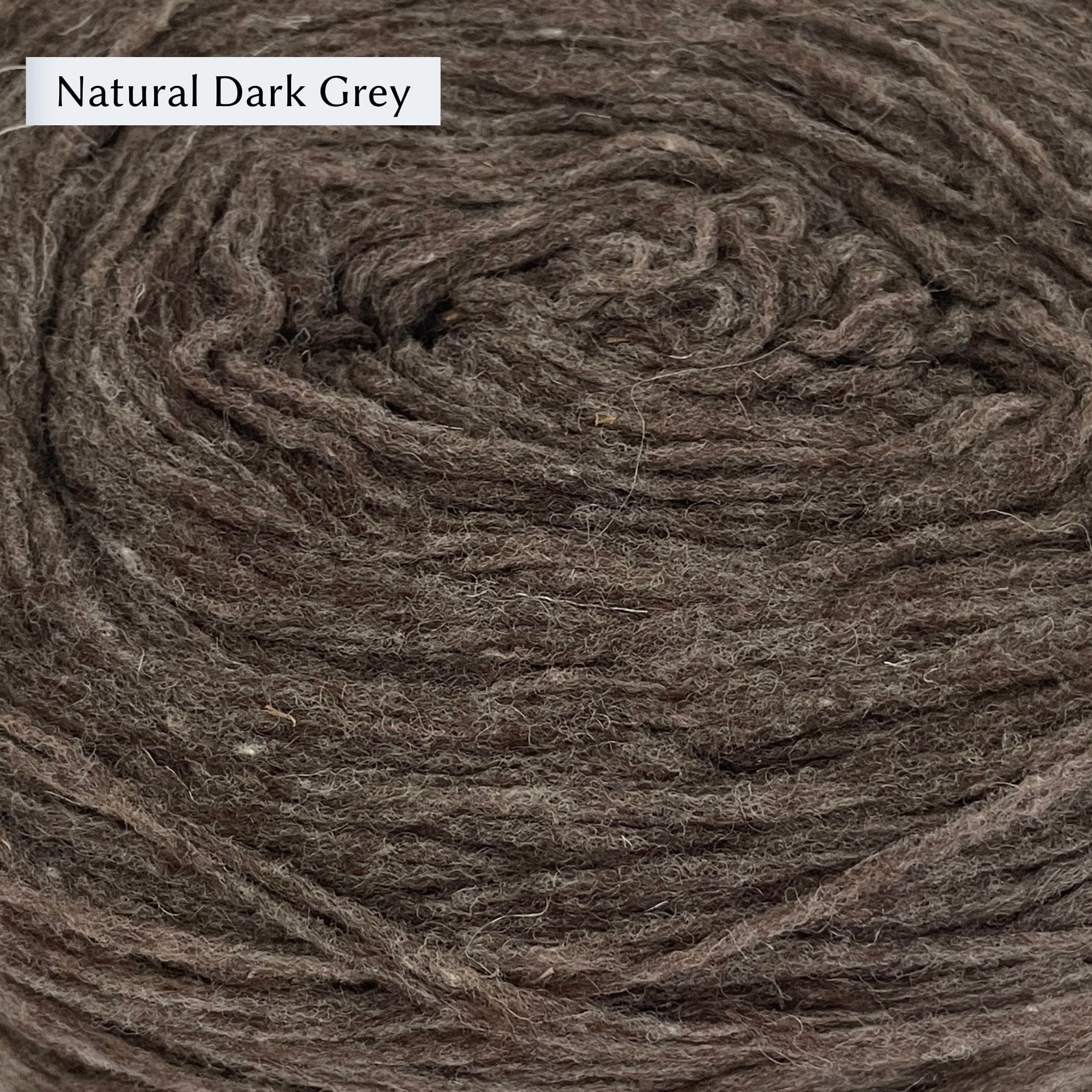 Manchelopis, a unspun yarn, in color Natural Dark Grey, a dark brown-grey