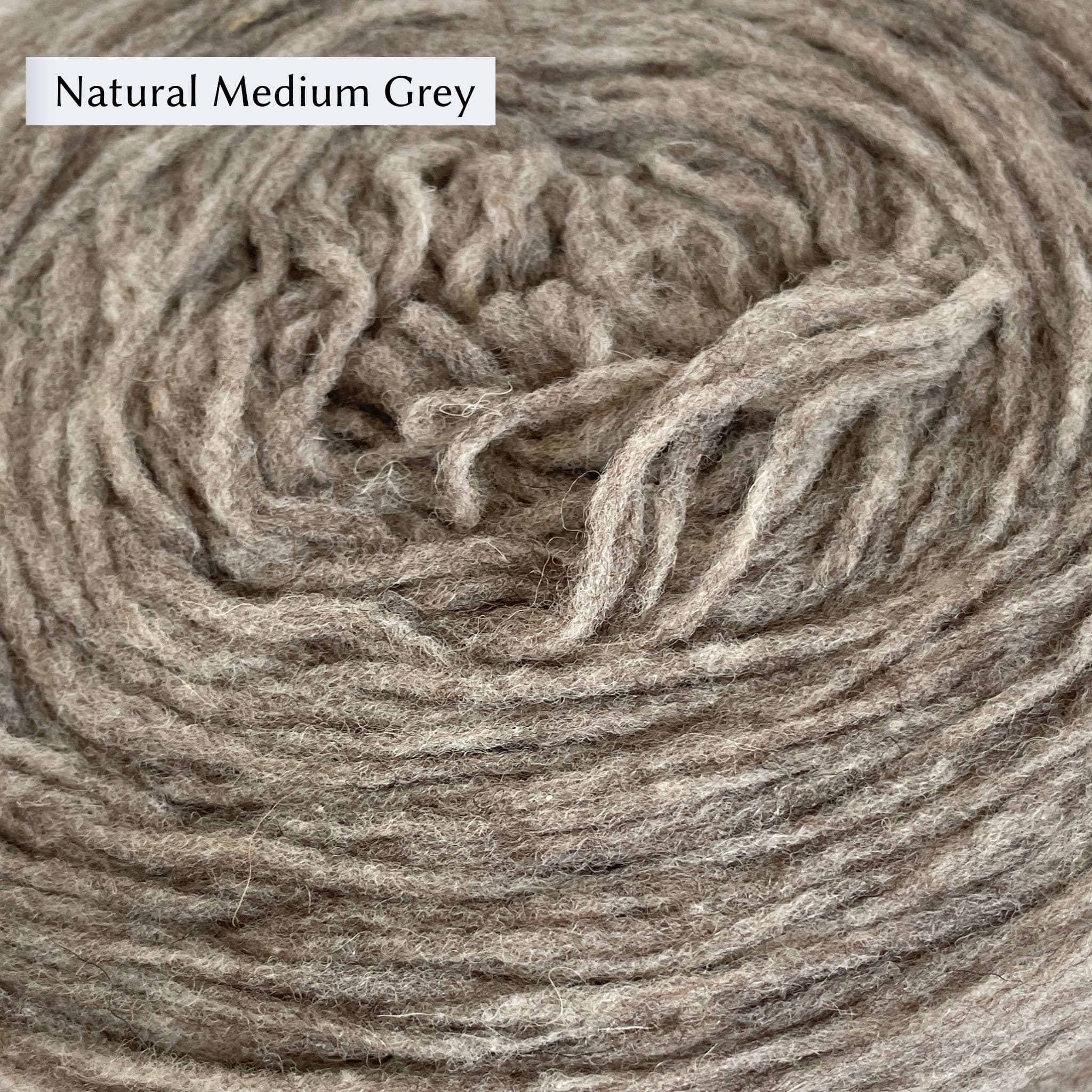 Manchelopis, a unspun yarn, in color Natural Medium Grey, a warm mid-tone light grey