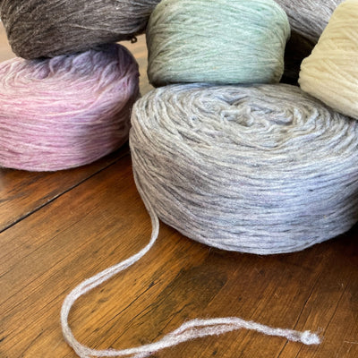 A pile of Manchelopis, an unspun yarn, on a table
