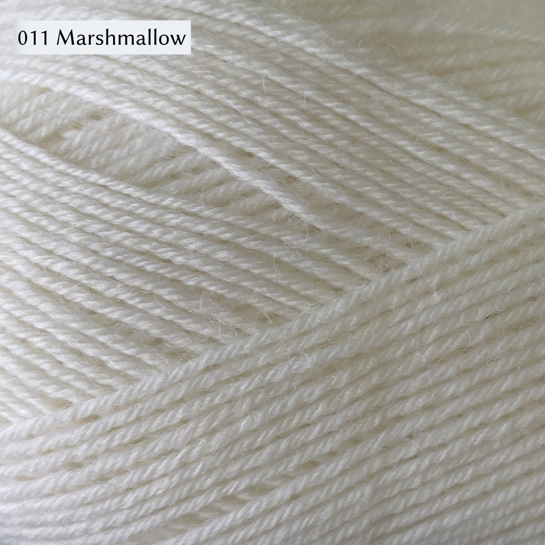 West Yorkshire Spinners Signature 4ply yarn, 100-gram ball, fingering weight, in 011 Marshmallow, a cool white.