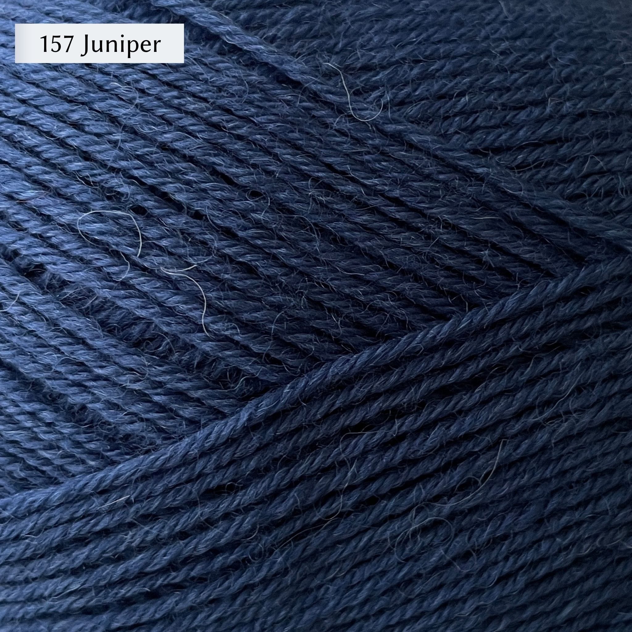 West Yorkshire Spinners Signature 4ply yarn, 100-gram ball, fingering weight, in color 157 Juniper, a medium denim blue