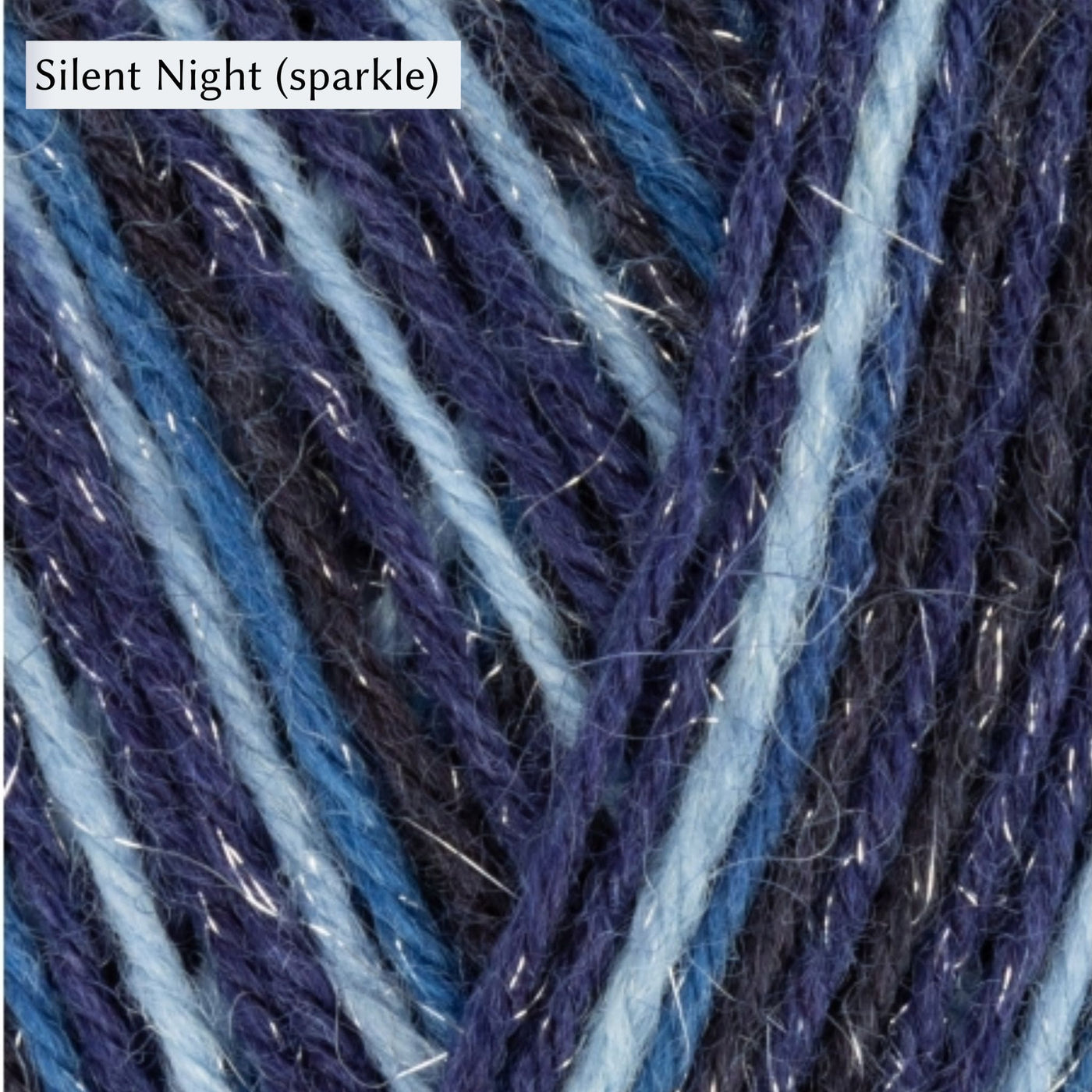 West Yorkshire Spinners Signature 4ply yarn, fingering weight, in color Silent Night (sparkle) with stripes of dark blues and light blue with sparkle